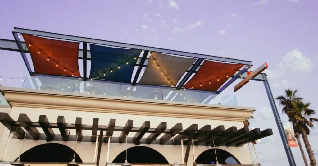 White Painted Building With Multicolored Awning