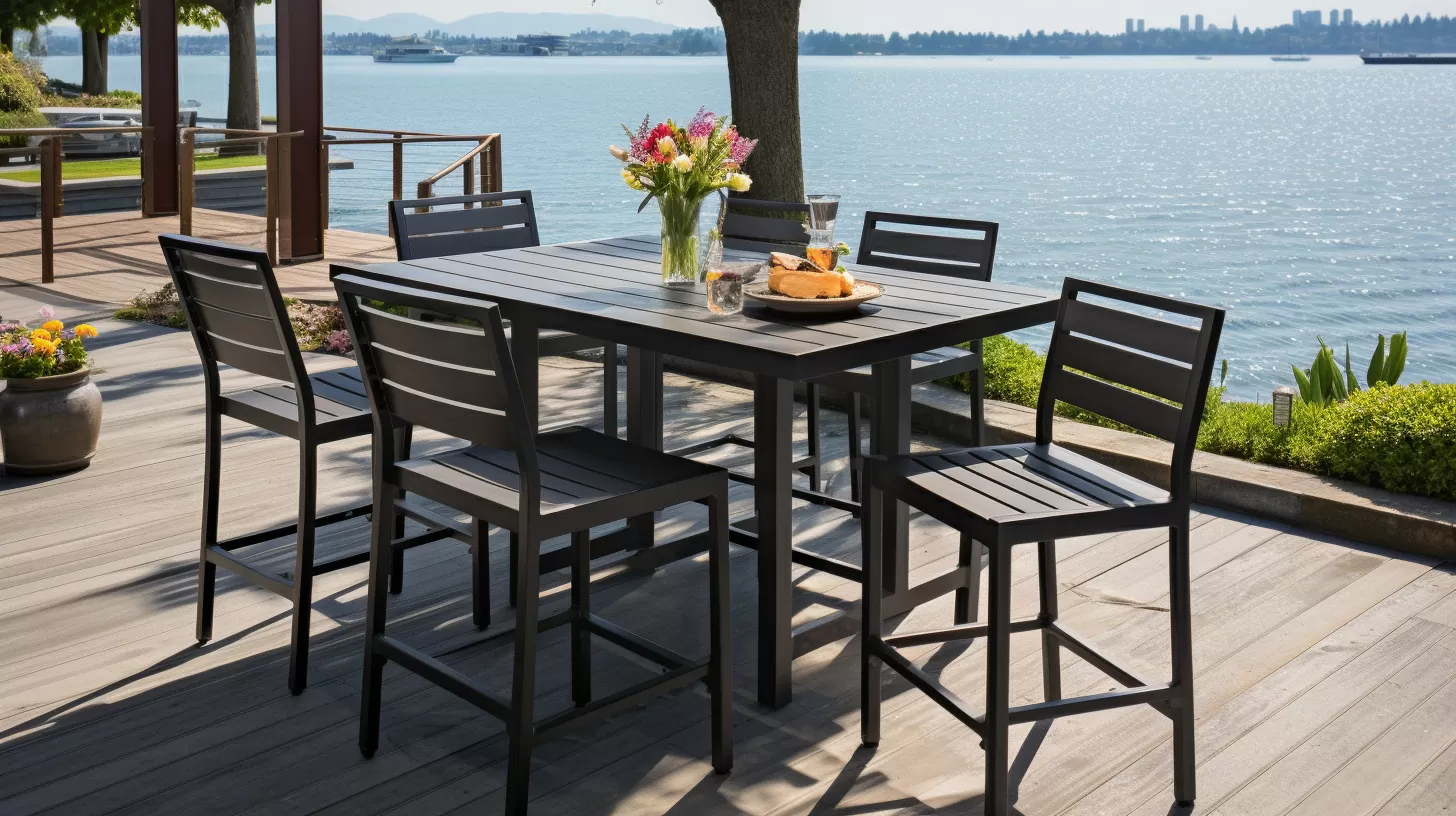 aluminum bar height dining set on a deck next to a lake