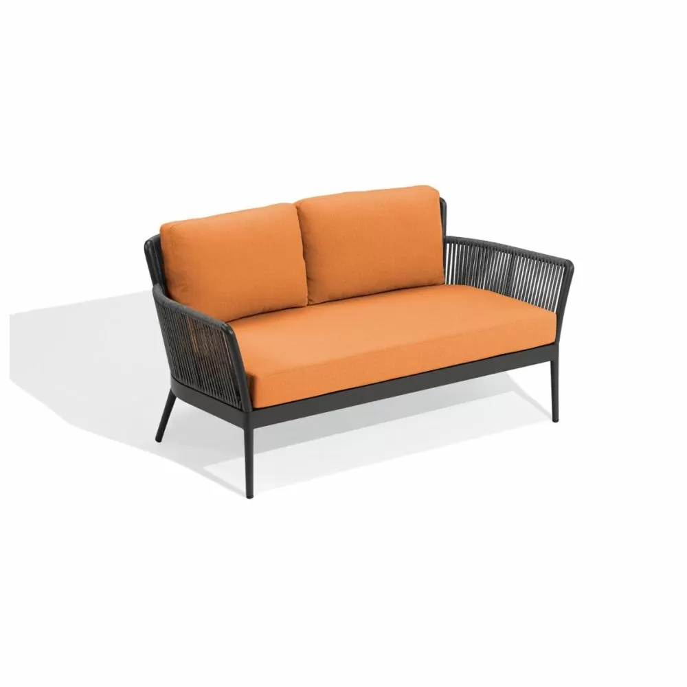 a photo of a Tangerine-colored Nette Cushioned Loveseat by Oxford Garden, available at PatioProductions.com