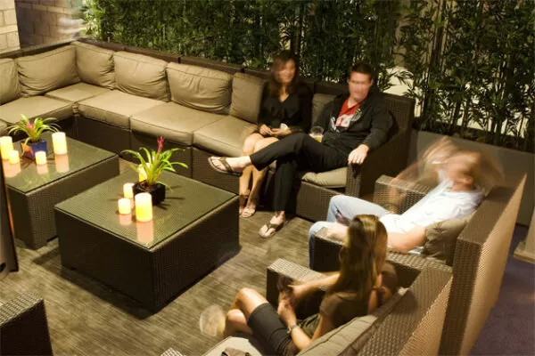 Home Depot Center VIP Lounge Hospitality Furniture - people chat in comfy club chairs during an evening event