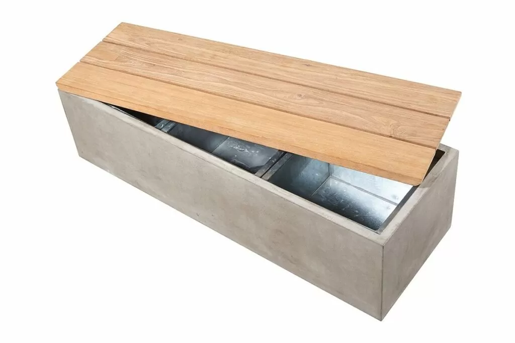 A concrete coffee table with hidden storage under a natural teak top is a functinoal and beautiful piece of outdoor decor