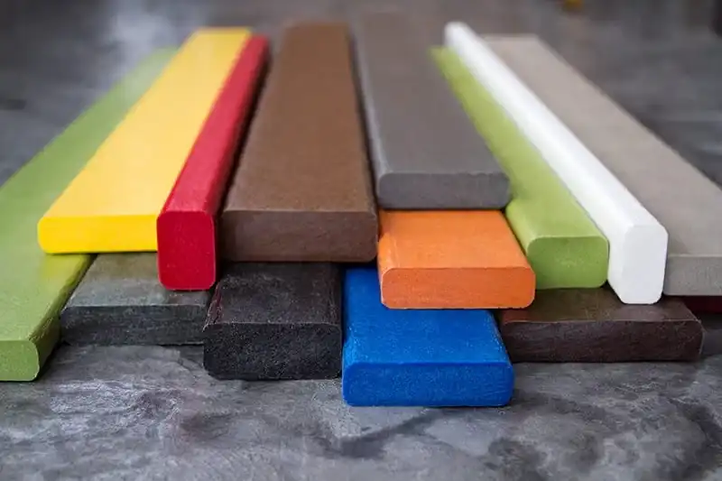Composite wood comes in a variety of durable colors - like this rainbow collage of various multicolored Polywood-brand composite wood lumber planks.